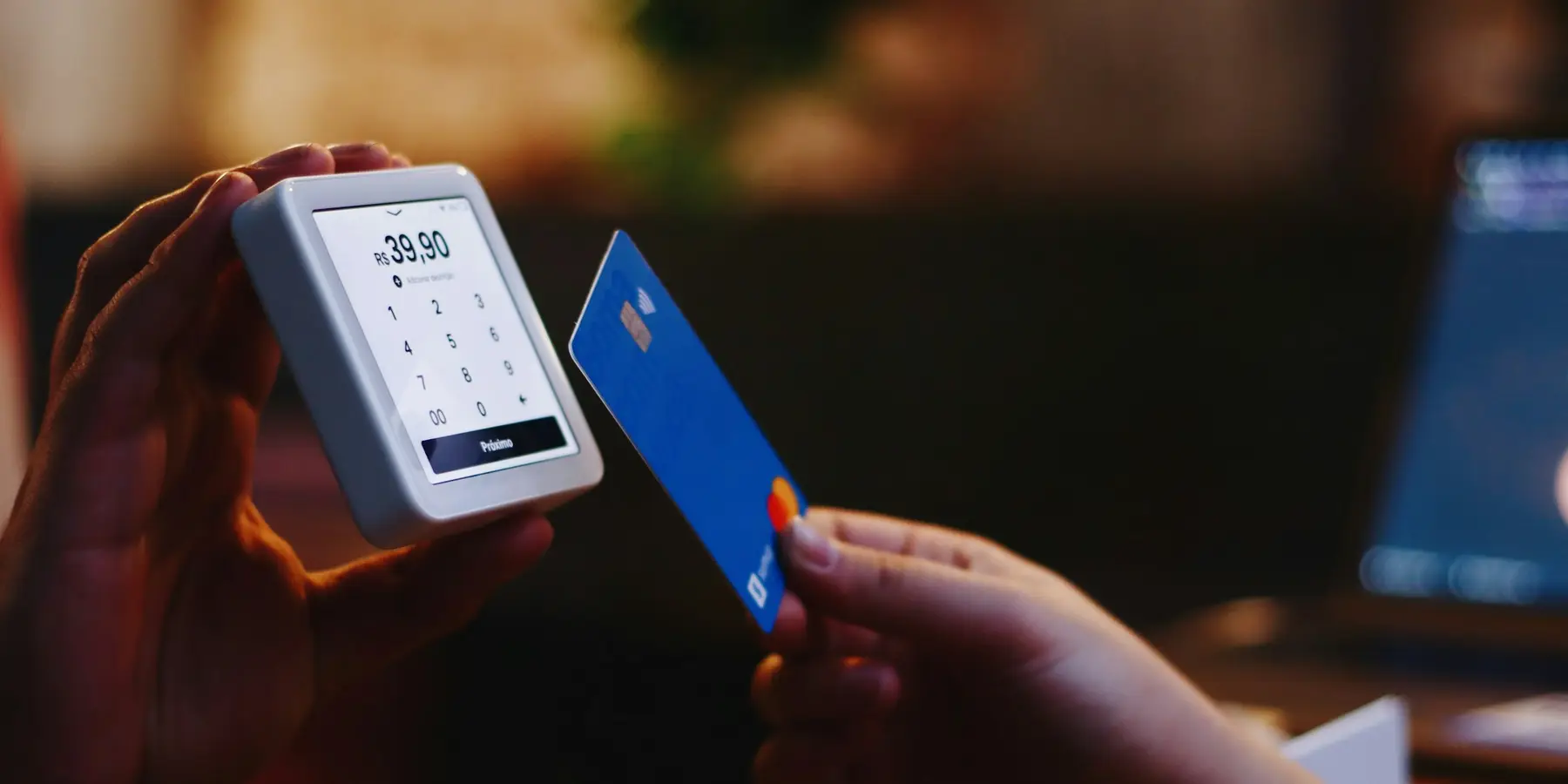 A card being handed to a payment terminal