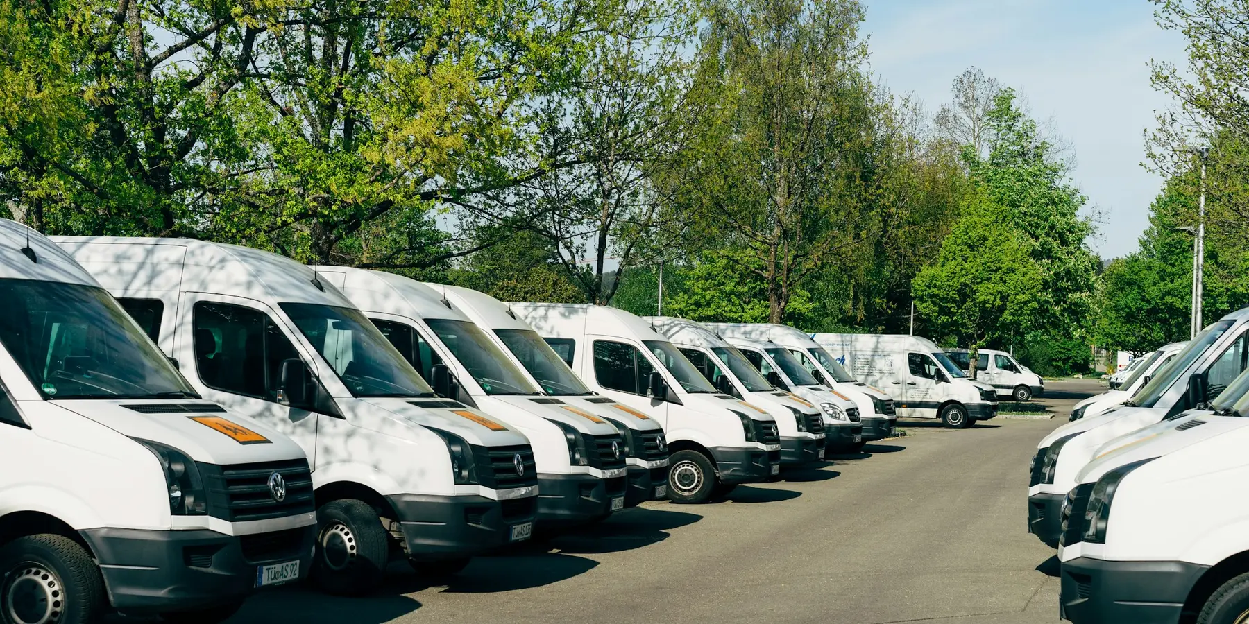 A fleet of work vans lined up