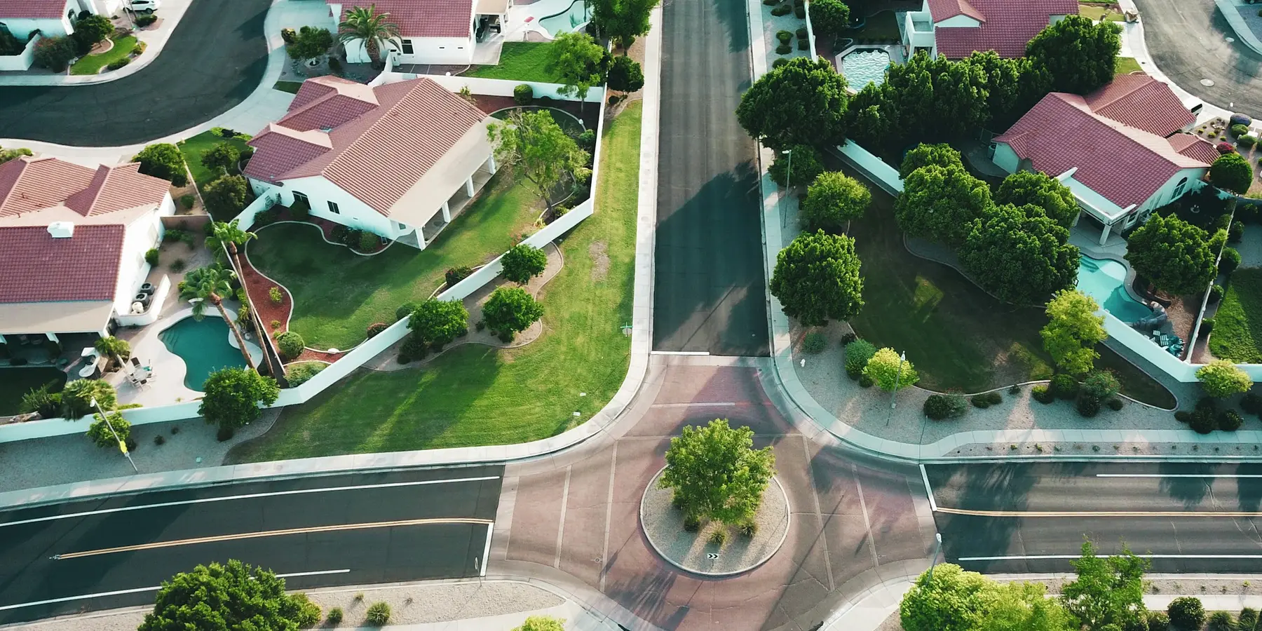 An aerial view of a residential neighbourhood of routed streets